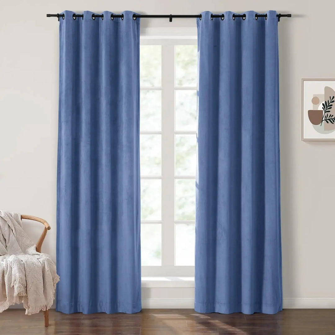 Soft blue velvet grommet curtains enhancing brightness in a cozy living room.