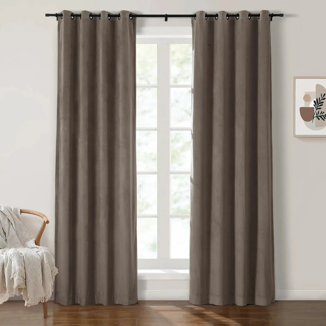 Dark brown grommet curtains in modern room with large windows and natural light.