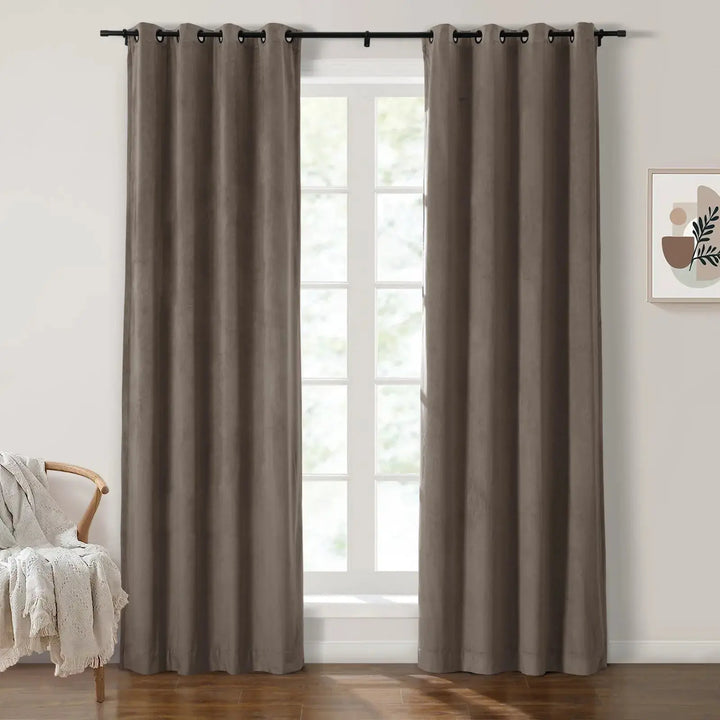 Dark brown grommet curtains in modern room with large windows and natural light.