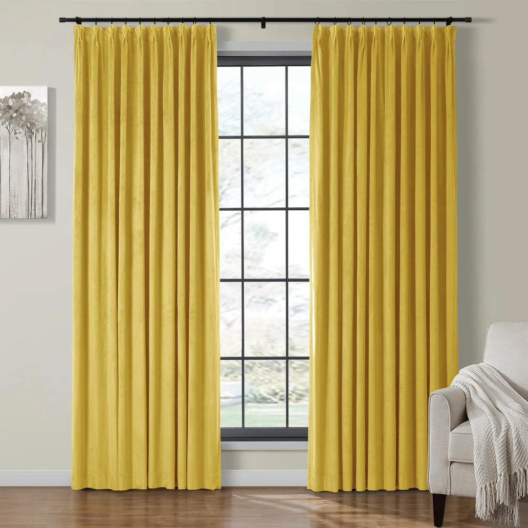 Light yellow velvet curtains framing a bright window in a cozy living room.