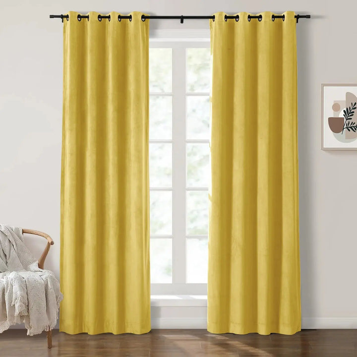 Mustard yellow grommet curtains framing sunny windows in a bright living room.