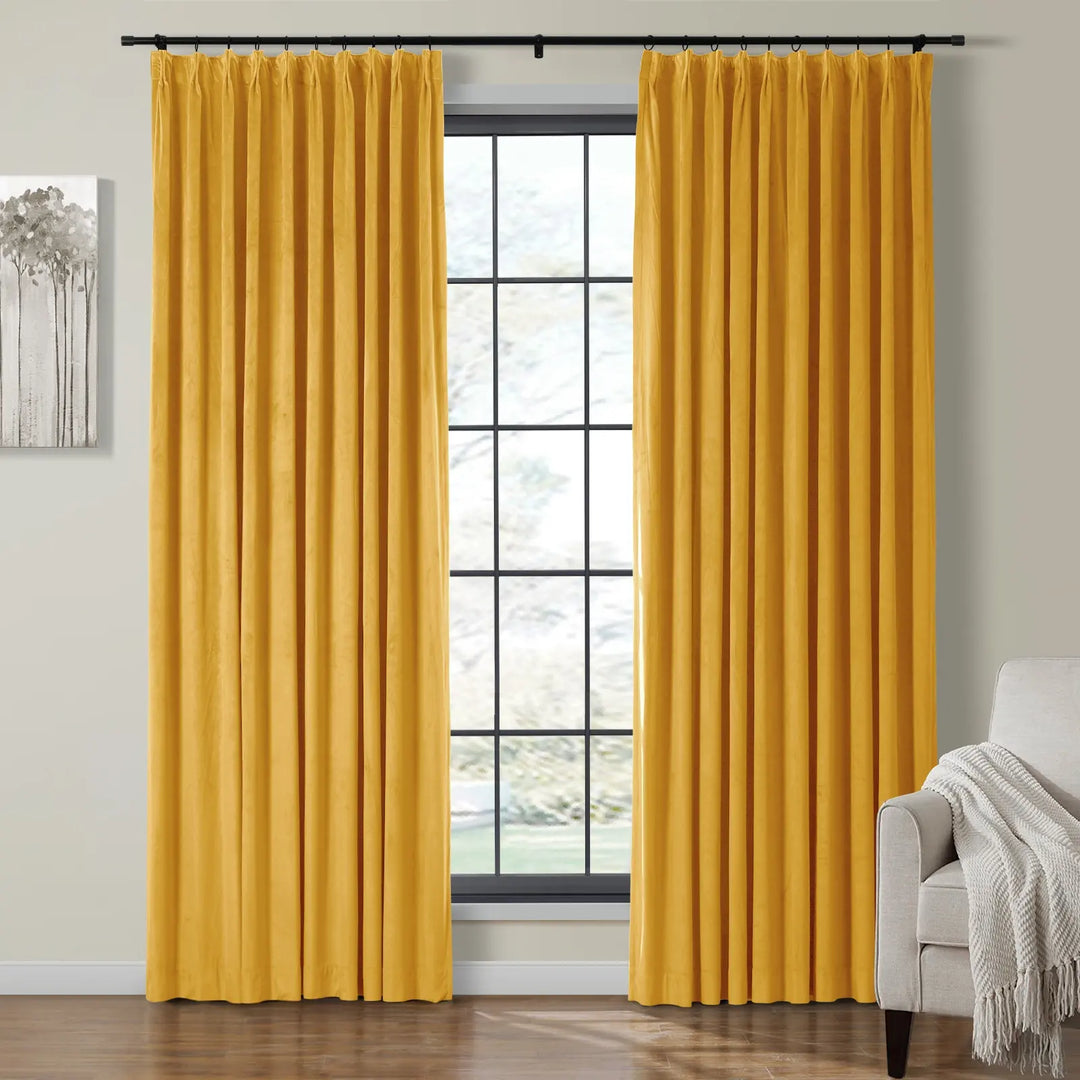 Bright yellow velvet curtains draped elegantly beside a living room window.
