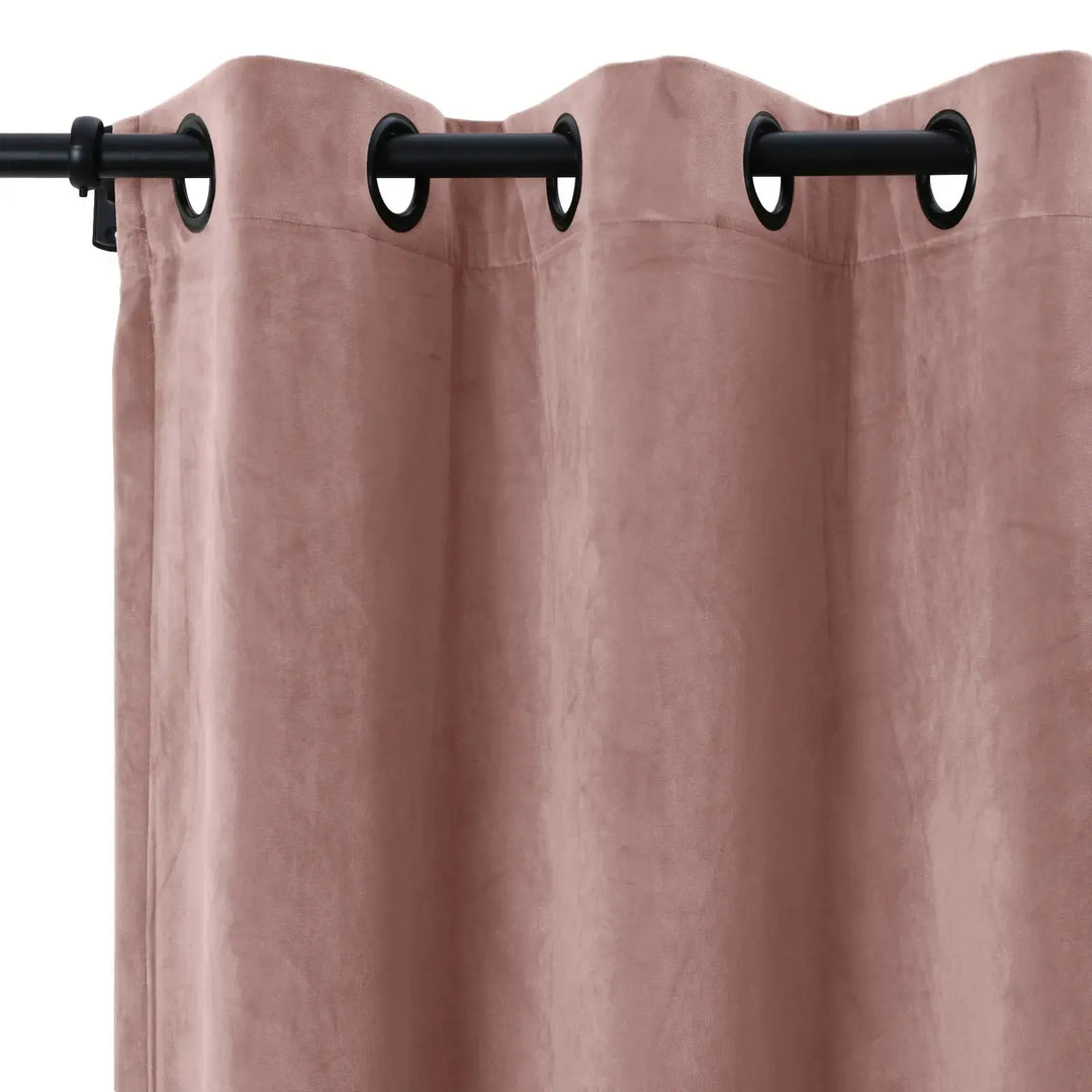 Blush velvet grommet curtains with a smooth texture, perfect for light dimming.