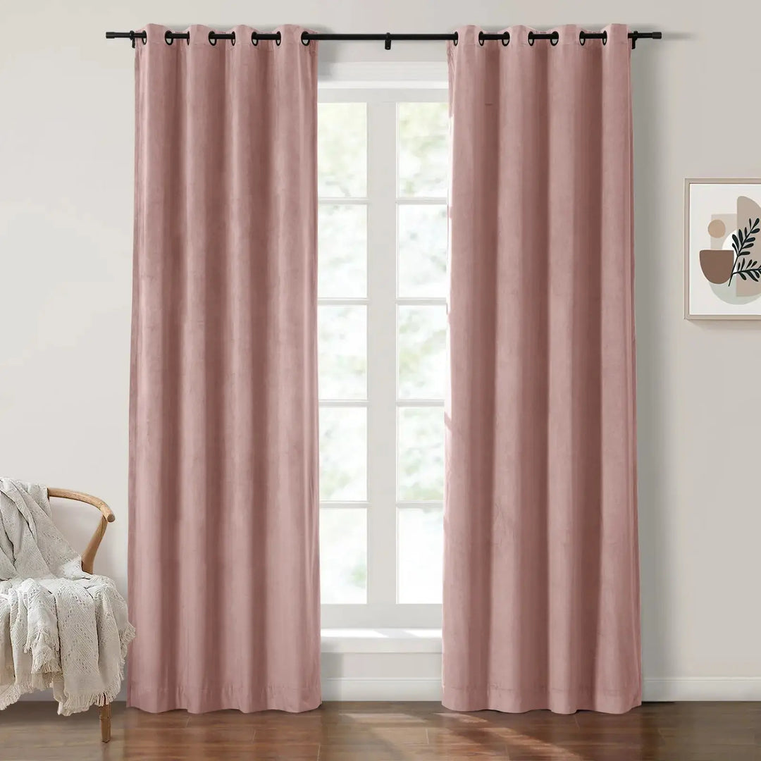 Blush velvet grommet curtains enhancing light in a bright living room.