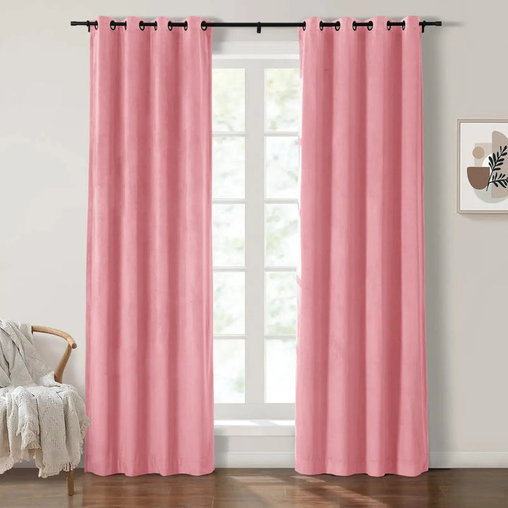Soft blush velvet grommet curtains framing large windows in a bright room.