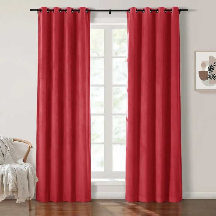 Red grommet curtains enhancing natural light in a bright living room with wooden floors.