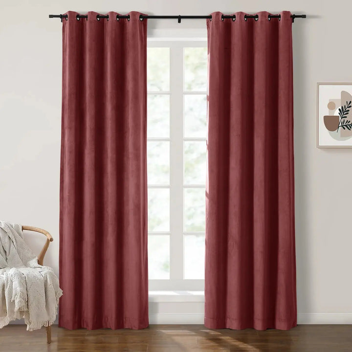 Red grommet curtains enhancing natural light in a cozy living room.