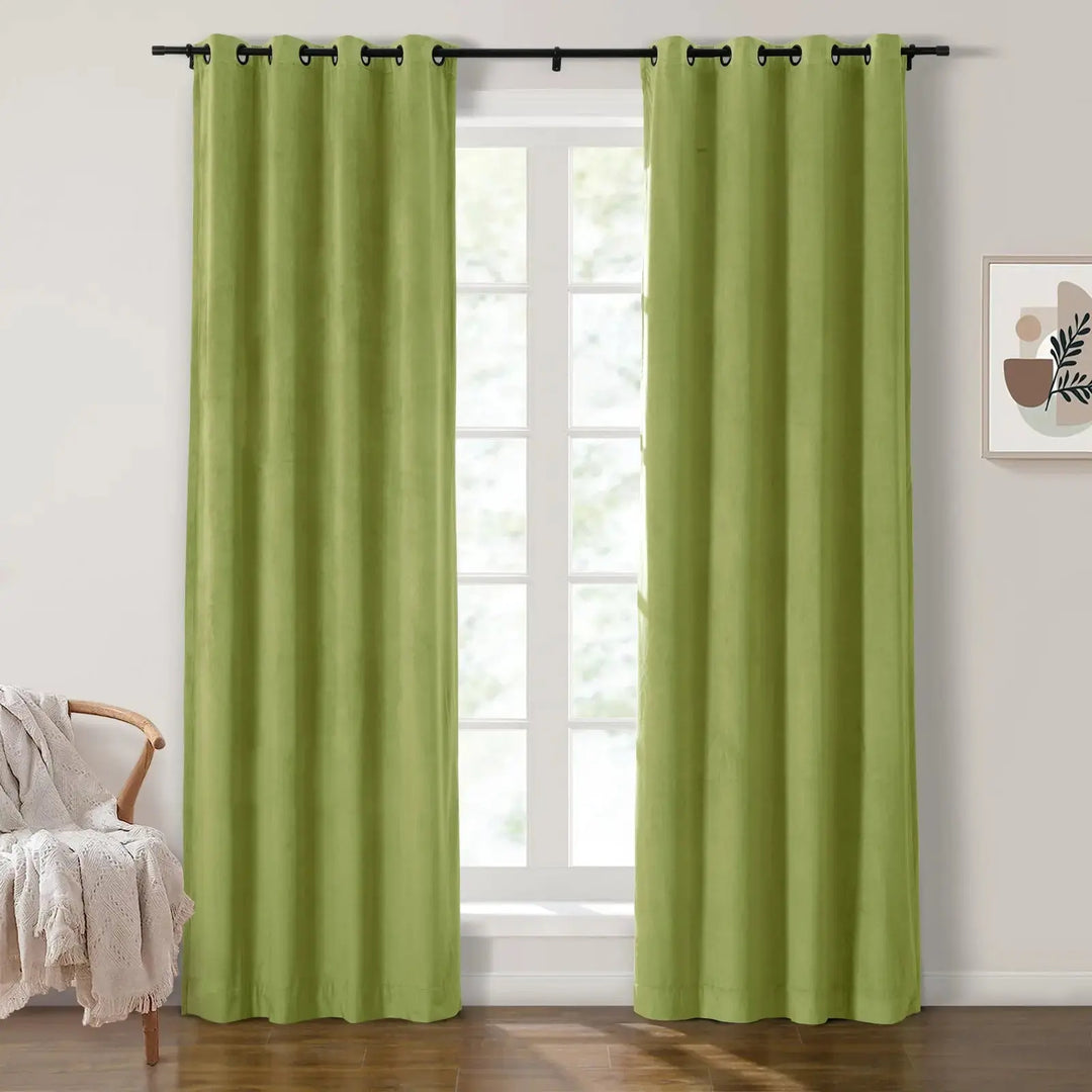 Green grommet curtains enhancing natural light in a bright living room.