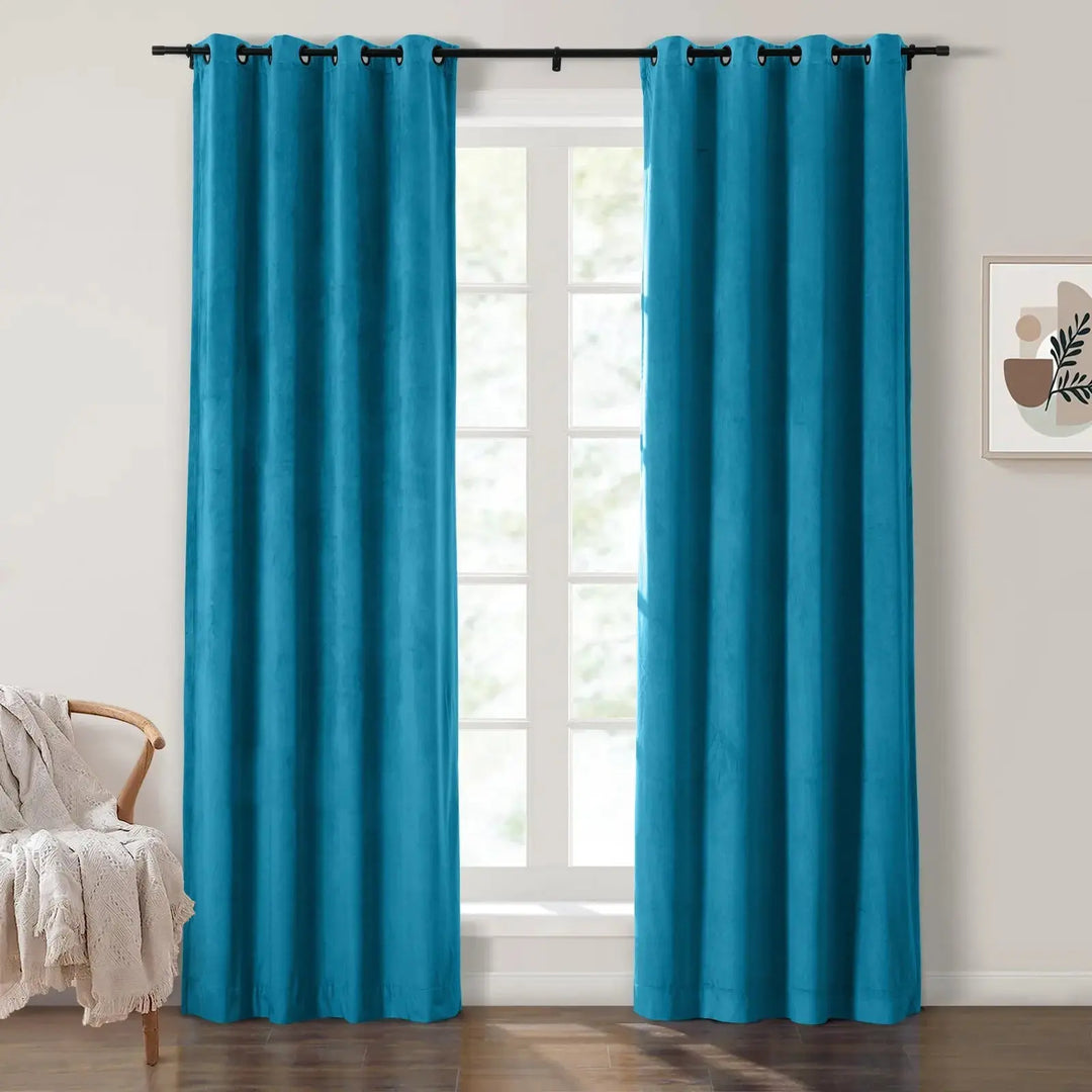 Turquoise grommet curtains enhancing natural light in a bright living room.