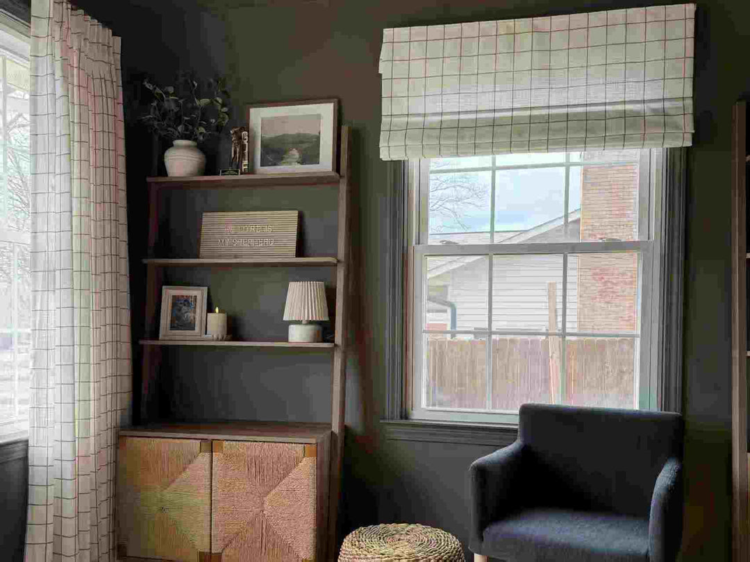 Roman shades with a subtle check pattern add a touch of style to a home office