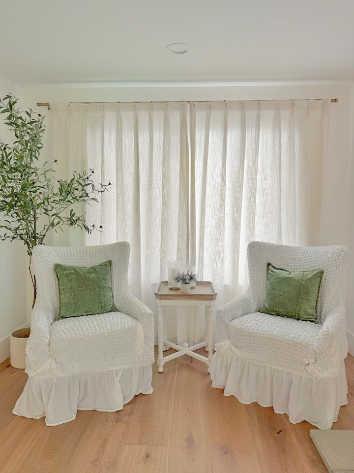 Light-filtering Belgian Linen Curtains frame the window, adding a touch of elegance